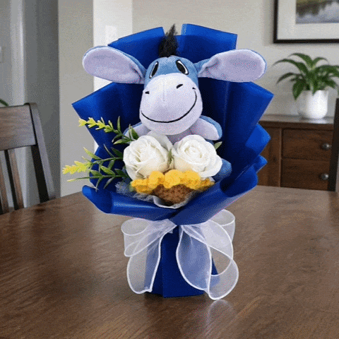 A finished handmade blue character bouquet ready to display